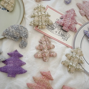 Detailed view of woven Christmas tree ornaments for DIY crafts and gift decor