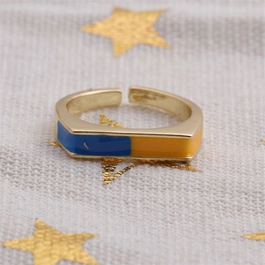 Detail of gold-plated rectangle ring with blue and yellow enamel Ukraine flag colors