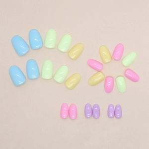 Short oval press-on nails in pastel macaron colors with a glossy finish for summer