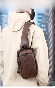 Brown litchi leather sling bag with adjustable strap and side anti-theft combination lock