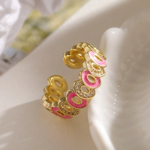 Bohemian gold-plated geometric ring with pink enamel and white zircon in open design