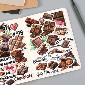 Close-up of doodle chocolate stickers scattered on a notebook for DIY craft journals