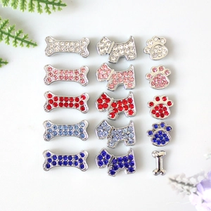 Macro shot of 8mm paw and dog shaped rhinestone charms for DIY jewelry making and bracelets