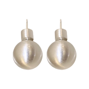 Minimalist silver spherical stud earrings with brushed matte finish on a white background