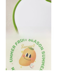 Close-up of food-grade plastic cutting board with cartoon mango print and non-slip edges