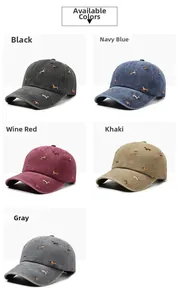 Close-up of washed cotton baseball caps with dog embroidery in various colors