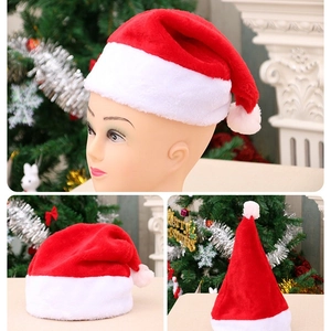 Classic red plush Christmas hat with white fur trim and pompom for adults and kids