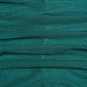 Detailed macro view showing the fine mesh texture and teal fabric weave of the dress