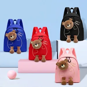 Cute children's teddy bear backpacks in blue, red, black, and pink with 3D plush details