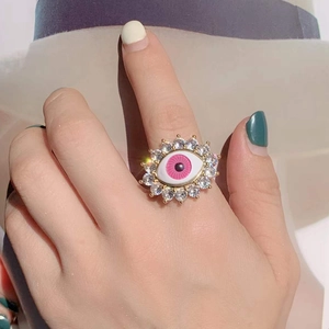 Pink evil eye open ring for women with zircon inlay and gold plated finish on finger