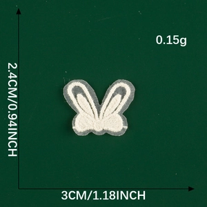 Detailed close-up of white lace butterfly patch with size and weight specifications