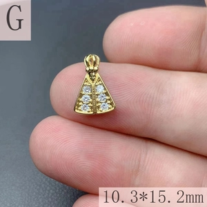 Detail shot of mini gold crown pendant showing 10.3*15.2mm dimensions and 6 clear zircons