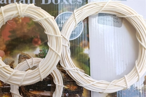 Close-up of handmade cream-colored Indonesian rattan rings for DIY Christmas wreaths