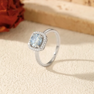 S925 Sterling silver ring with a round blue moissanite center stone and halo design