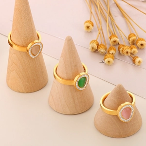 Gold stainless steel teardrop stone rings set with apricot, green and pink gems