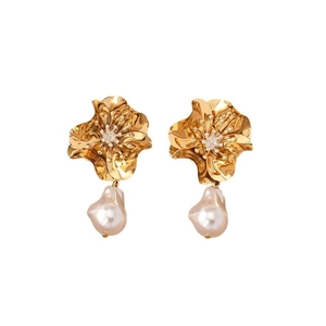 Fashionable gold flower earrings with sparkling crystals and baroque pearl drops