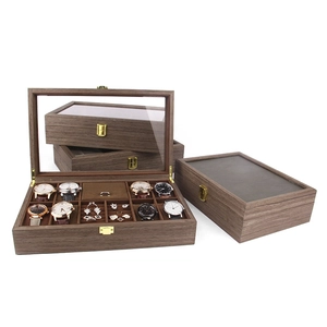 Wooden watch and jewelry organizer box with clear glass lid and velvet interior display.