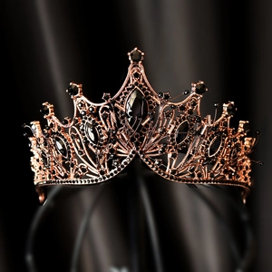 Detailed close-up of luxury bridal crown with black rhinestones on rose gold base