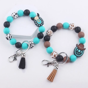 Western style silicone beaded keychain bracelets with cow print beads and leather tassel