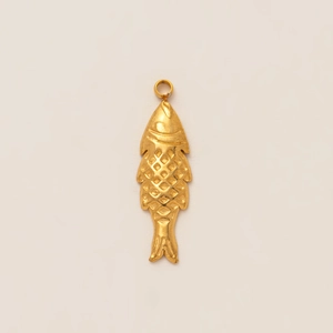 Detailed macro view of a 18K gold plated fish-shaped pendant with scale texture