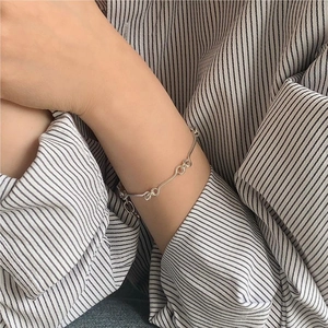 Minimalist S925 sterling silver chain bracelet on wrist with interlocking links