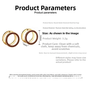 Detailed view of 14.4mm gold titanium steel hoop earrings featuring red zircon stones