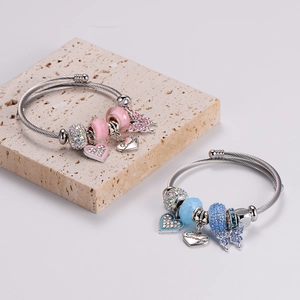 Adjustable stainless steel beaded bracelet with pink heart and butterfly charms