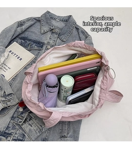 Spacious pink canvas tote bag showcasing large capacity for laptop and daily essentials