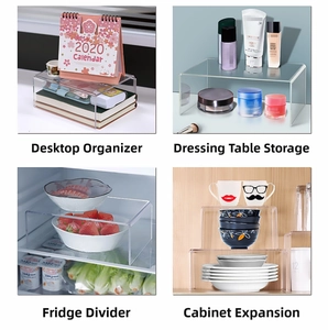 Detailed view of clear acrylic U-shaped riser shelves used for multi-layered desktop storage