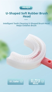 Close-up of pink soft silicone U-shaped replacement brush head for toddlers' oral care