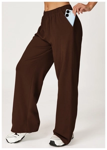 Detail shot of deep brown high-waisted wide leg sweatpants with side pocket