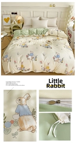 Detail of soft duvet cover featuring cartoon rabbit prints and metal zipper closure