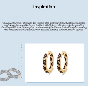 Detailed close-up of leopard pattern hoop earrings with zircon pavé setting and gold plating