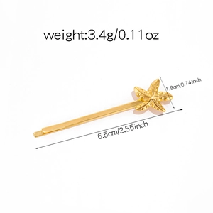 Macro detail of golden starfish hair clip with precise size and weight specifications