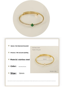 Detail of 18K gold-plated stainless steel bangle with emerald green zircon and full diamonds