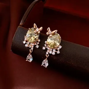 Luxury 18k gold plated bow earrings with yellow zircon, pearls, and teardrop pendant