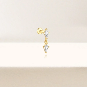 Detail shot of golden S925 sterling silver ear stud with double rhombus cubic zirconia