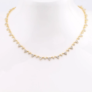 Elegant gold S925 sterling silver necklace with triangular white zircon stones on mannequin