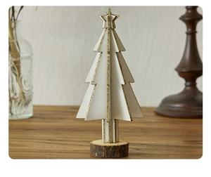 Detailed close-up of a white wooden mini Christmas tree with gold glitter and natural wood base