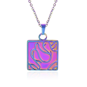 Macro shot of square stainless steel necklace pendant with colorful floral engraving