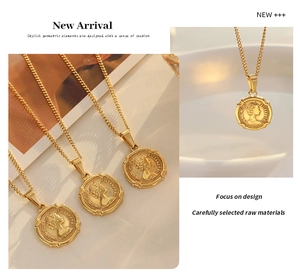 Detailed close-up of gold coin pendant necklace featuring Queen Elizabeth II relief