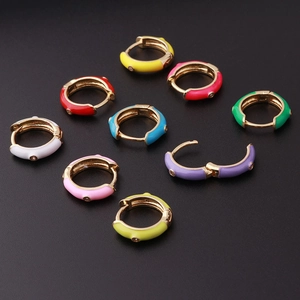 Vibrant candy colored enamel hoop earrings in gold finish with small crystal accents