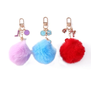 Plush faux rabbit fur ball keychains with Christmas charms and golden metal rings