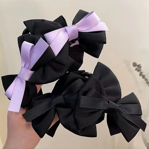 Elegant large bow hair claw clip with black and purple satin ribbons for women's hairstyles