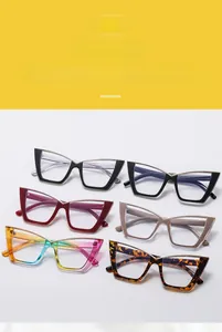 Flat lay of six colorful cat-eye glasses frames with stylish V-shaped metal accents