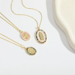 Three gold layered necklaces featuring oval Virgin Mary pendants with pink enamel and zircons