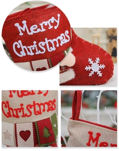 Weihnachtsstrumpf Detailaufnahme rotes Jute hängende Süßigkeitentasche Dekoration