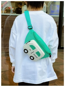Detail of green cartoon car-shaped chest bag for boys with adjustable strap and logo