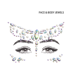 Macro detail of iridescent butterfly face jewels with acrylic rhinestones and pearls