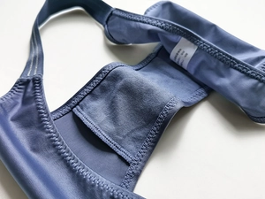 Detail of blue ice silk thong featuring smooth fabric, honeycombed lining and wash label